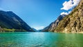 The clean green water of Seton Lake on the foot of Mount McLean near Lillooet Royalty Free Stock Photo