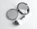 Compact Mirror and Makeup Brush on White Background Royalty Free Stock Photo