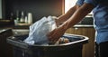 Clean Kitchen Commitment - Hands of a person throwing away a trash garbage bag in a trash bin in the kitchen. Generative AI