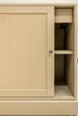 Light sliding cabinet door with shelves inside. Minimal home storage. Royalty Free Stock Photo