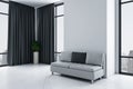 Clean living room with sofa, panoramic city view and blank wall