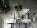 Clean loft style bathroom interior with white modern sink basin and brass faucet. Royalty Free Stock Photo