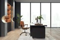 Clean luxury office interior with window and city view, bookcase and other objects. Royalty Free Stock Photo