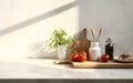 Clean minimal white marble kitchen countertop with cooking ingredients tomato asparagus bowl in morning sunlight on white square Royalty Free Stock Photo