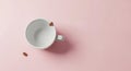 Minimalist Coffee Cup and Beans on Pink Background Royalty Free Stock Photo