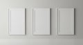Three Blank Vertical Picture Frames Mockup on Minimalist Grey Wall Royalty Free Stock Photo