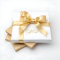 Modern White Gift Card with Elegant Gold Ribbon Bow and Minimalist Design for Festive Occasions Royalty Free Stock Photo