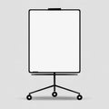 A clean, minimalist white board on a wheeled, tripod-like black frame, on light gray Royalty Free Stock Photo