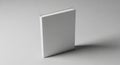 Clean minimalist white square standing upright casting subtle shadow on light gray surface Royalty Free Stock Photo
