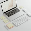A clean, minimalistic workspace features a silver laptop open to a software design