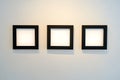 Three Modern Black Square Frames on White Wall - Minimalist Interior Design Mockup Royalty Free Stock Photo