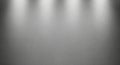Spotlights illuminating a textured gray background Royalty Free Stock Photo