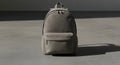 Minimalist Grey Backpack on Concrete Surface with Shadow Royalty Free Stock Photo