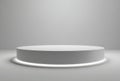 Minimalist White Stage Pedestal With Subtle Neon Light Ring In A Soft Lit Studio Background Royalty Free Stock Photo