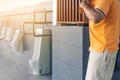 Clean and modern public men toilet with friendly design for people with disability or elderly with stainless steel handles and all Royalty Free Stock Photo