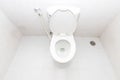 A clean modern toilet bowl and rising spray. Top view white toilet bowl in a bathroom Royalty Free Stock Photo