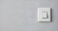 Modern White Light Switch on Grey Wall Royalty Free Stock Photo