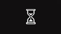 Minimalist white hourglass icon on a black background representing time and deadlines Royalty Free Stock Photo