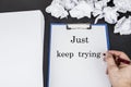 Clean notepad and pen with ball paper. Just keep trying concept Royalty Free Stock Photo