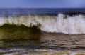 Clean ocean wave rolling curling lip crashing on shallow sandbars