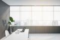 Clean office interior with mock up place, workplace desk, laptop, chair, decorative plant, blinds and daylight. Royalty Free Stock Photo