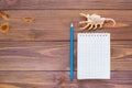 Clean open notepad for writing, pencil and seashell Royalty Free Stock Photo