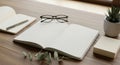 Minimalist Workspace with Notebooks, Glasses, and Plant Royalty Free Stock Photo