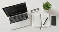 Overhead view of a laptop notebook glasses and plant on a desk Royalty Free Stock Photo