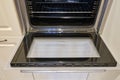 A clean oven with washed glass built into the furniture in the home kitchen Royalty Free Stock Photo