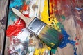 clean paintbrush next to a paintbrush covered in dried paint