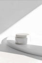 A clean and professional commercial mockup featuring a cream container elegantly presented on a solid white background The Royalty Free Stock Photo