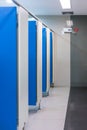 Clean public toilet room empty with blue door. Royalty Free Stock Photo