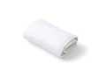 Clean rolled fabric towel with textured surface on light background Royalty Free Stock Photo