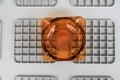 Clean round glass ashtray on grey plastic box. The concept of the harm of smoking. Royalty Free Stock Photo