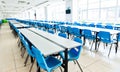 Clean school cafeteria with seats and tables