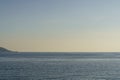 Clean seascape background with blue light evening sky and horizon. Summer evening sea after sunset or before sunrise Royalty Free Stock Photo