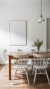 Clean, serene room with wooden table, white chairs, and blank canvas on neutral colored walls