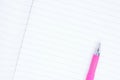 Clean sheet of notebook close up, ballpoint pens close up lie on a notebook sheet, place for text, school notebook, business noteb Royalty Free Stock Photo