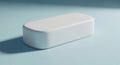 Minimalist white rectangular object with rounded edges casting subtle shadow on a pale surface Royalty Free Stock Photo