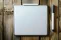 Minimalistic whiteboard and marker on wooden surface