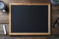 Clean small blackboard, coffee, chalk and glasses on wooden table, flat lay