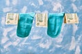 Clean socks and 10 dollar bills are dried on clothesline