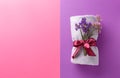 Clean soft towel tied with ribbon on color background