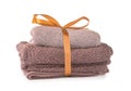 Clean soft towels tied with ribbon on white background