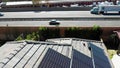 Clean solar alternative, renewable energy panels on house rooftops. Aerial solar project