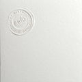 Elegant Embossed Seal on White Paper Royalty Free Stock Photo