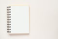 Clean spiral note book for notes and messages on rlight beige background. Minimal business flat lay