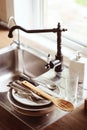 Clean stack of dishes on the kitchen sink