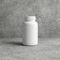 A white plastic bottle with a ribbed cap on a grey surface against a grey textured background wall Royalty Free Stock Photo