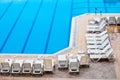 Clean swimming pool and empty resting chairs Royalty Free Stock Photo